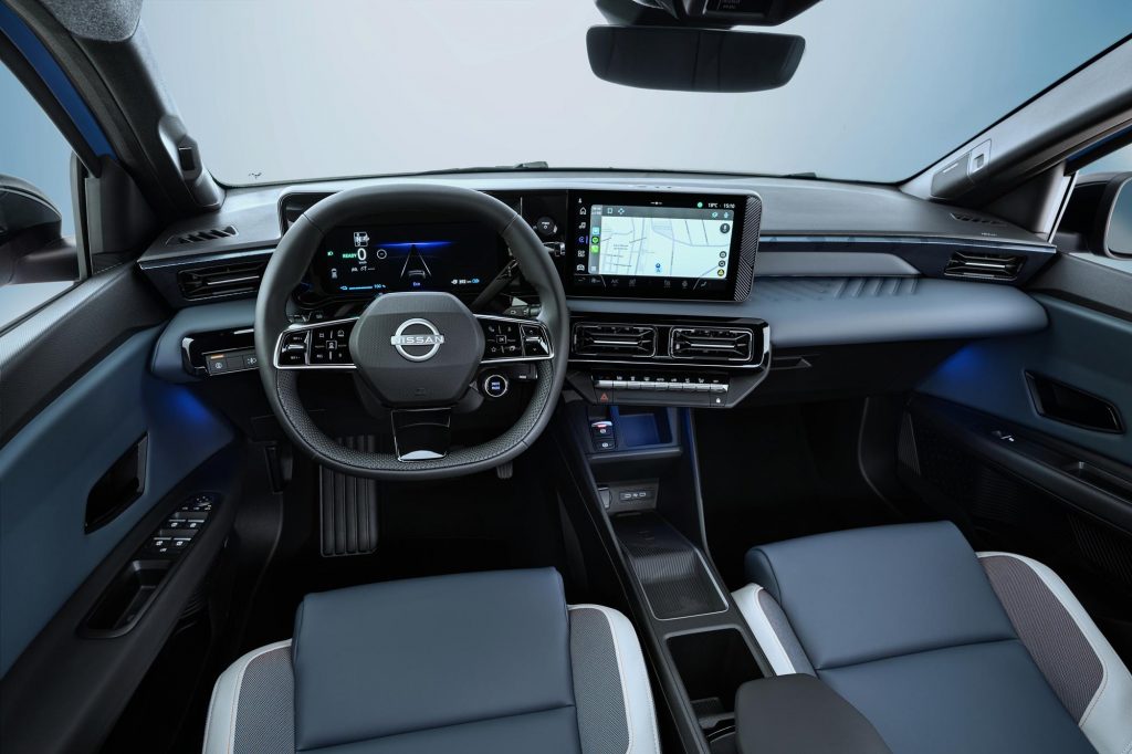 full dashboard view of cockpit from driver POV showing steering wheel. driver focused infotainment, front seats, and blue ambient lights below the dashboard. Google maps navigation on screen